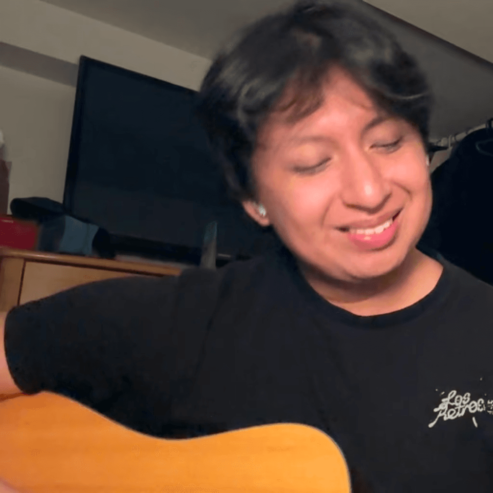 Dennis playing guitar